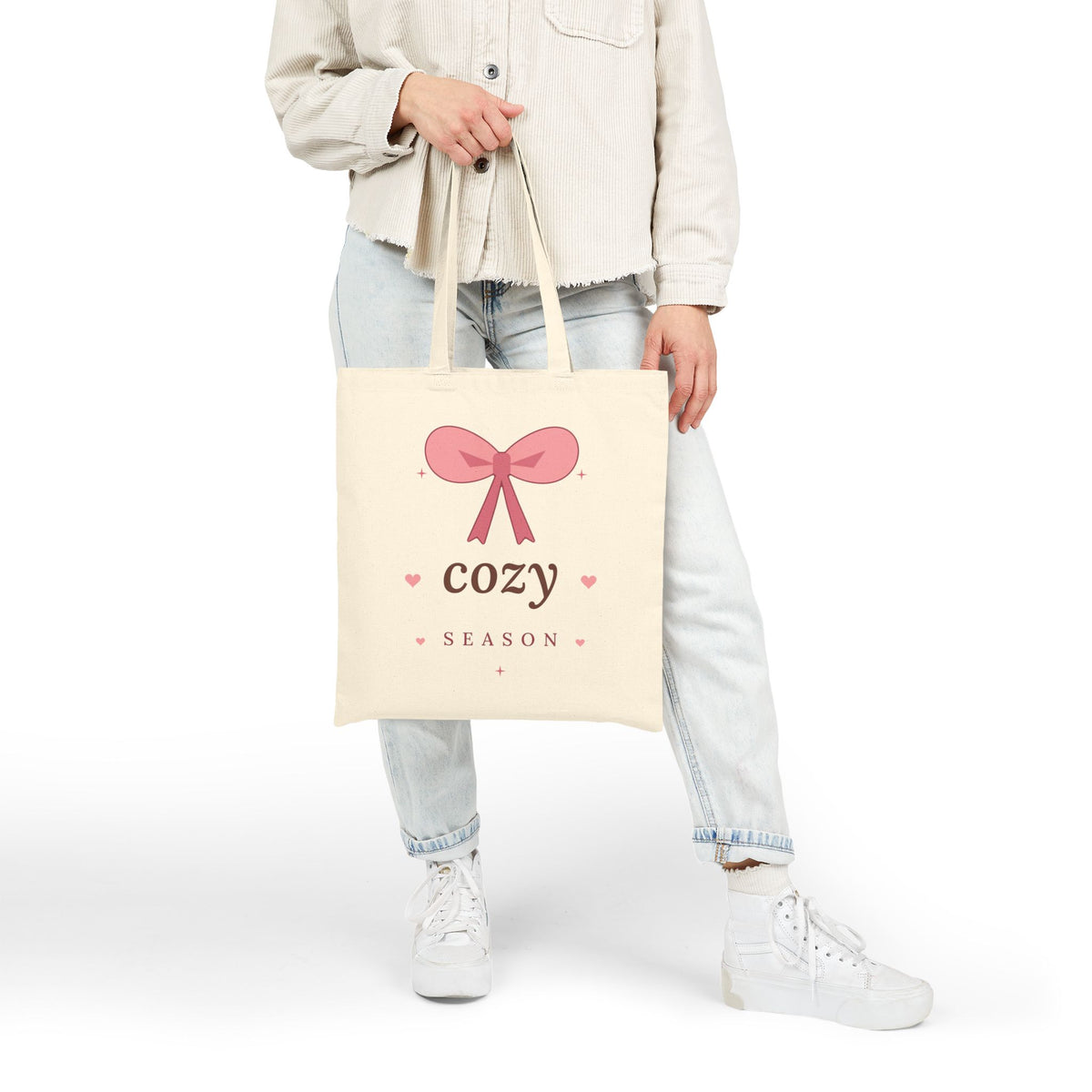 Cozy Season Canvas Tote Bag, natural, lifestyle photo held over the shoulder