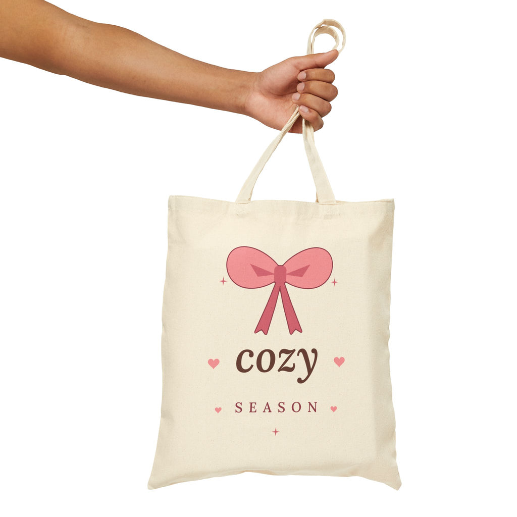 Cozy Season Canvas Tote Bag, natural, held up by hand