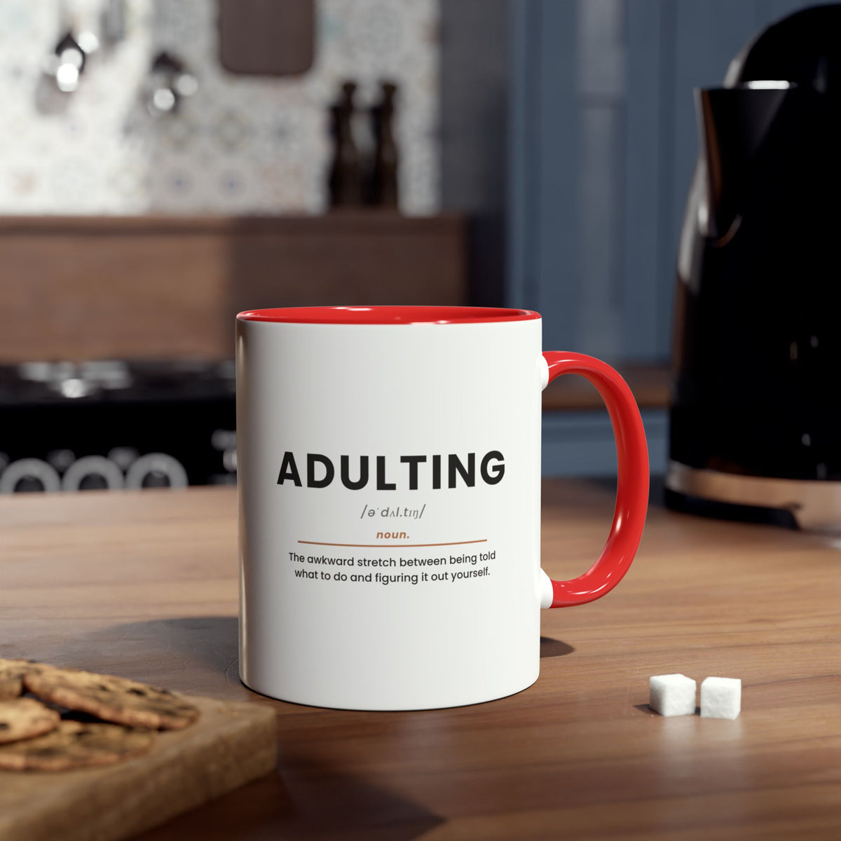 Adulting Definition Coffee Mug, Red, lifestyle photo on kitchen counter
